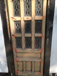 The door was braced together with large screws so that the joints could be cut open and reinforced.